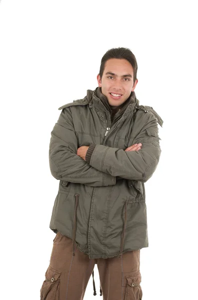 Молодой человек в зеленой куртке позирует — стоковое фото