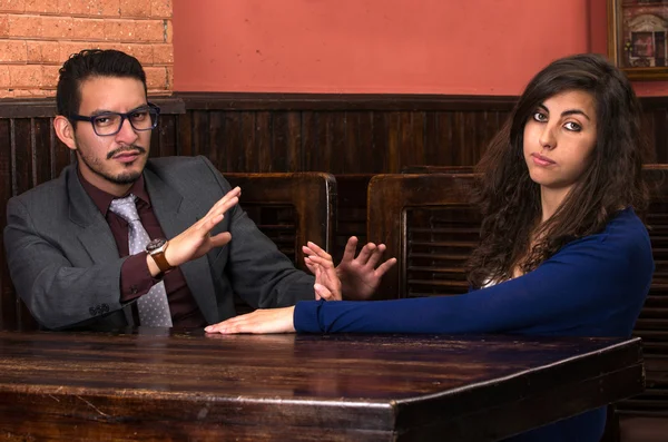 Young latin couple in a restaurant — Stock Photo, Image