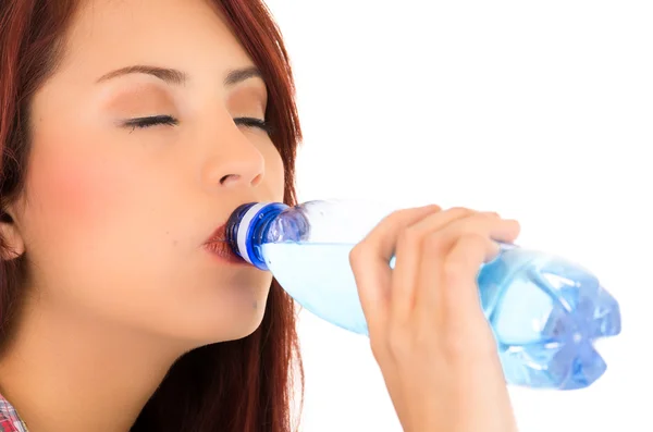 Beautiful young girl drinking water — Stock Photo, Image