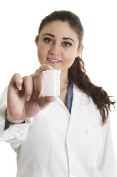 Young beautiful female doctor holding a pill bottle — Stock Photo, Image