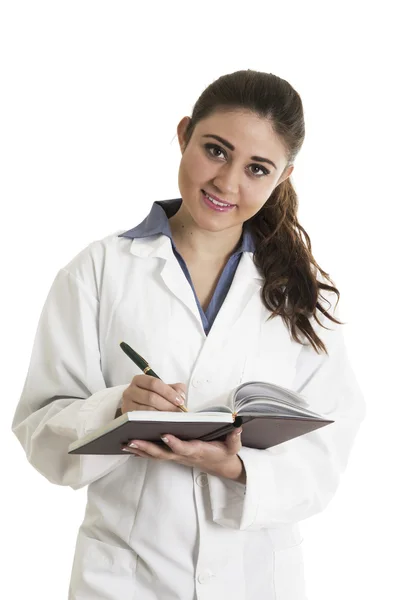 Young beautiful female doctor holding a notebook Royalty Free Stock Images