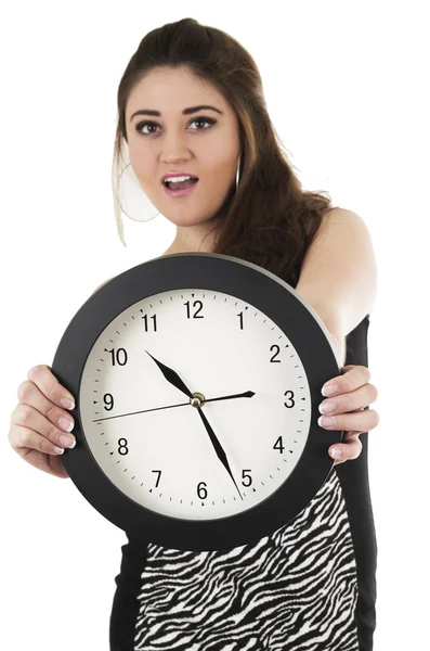 Pretty young hispanic girl holding black round clock — Stock Photo, Image