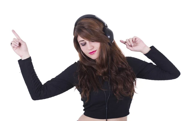 Chica bastante joven con auriculares escuchando música y bailando —  Fotos de Stock