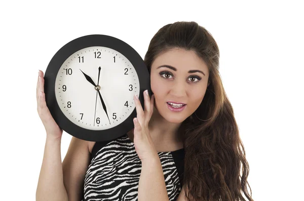 Beautiful young woman holding big round clock — Stock Photo, Image
