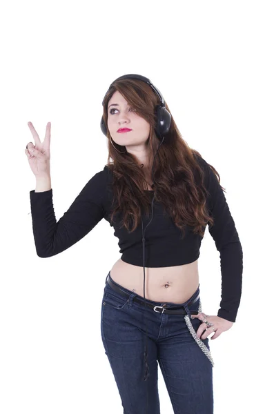 Chica bastante joven con auriculares escuchando música y bailando —  Fotos de Stock