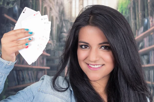 Pretty young brunette woman posing with deck of cards — Stock Photo, Image