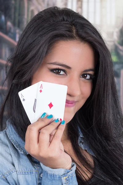 Beautiful young girl holding deck of cards — Stock Photo, Image