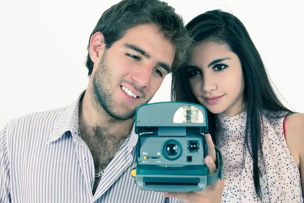 Cute couple taking photos with instant old camera — Stock Photo, Image