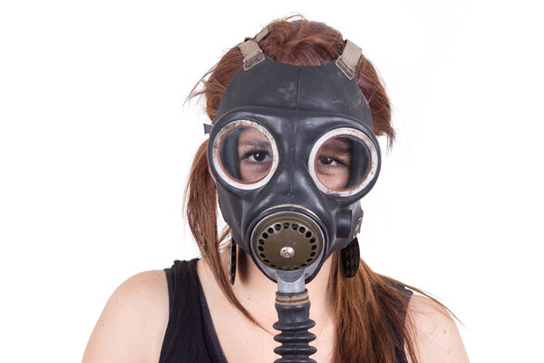 Young girl wearing gas mask