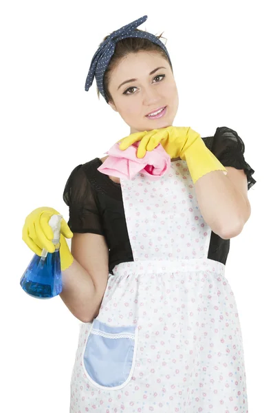Mladá dívka nosí zástěru a držení čisticí produkty — Stock fotografie