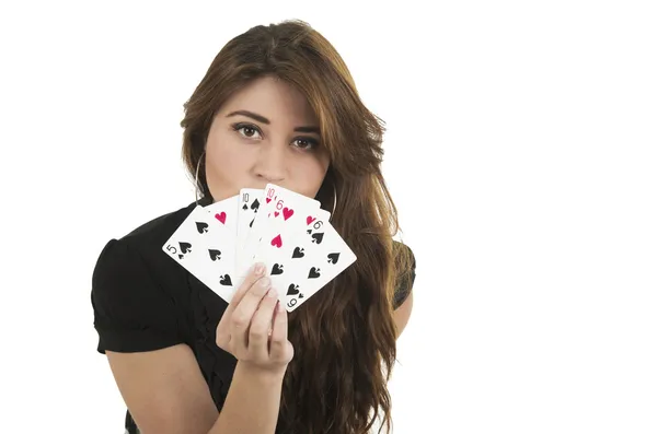 Beautiful young girl holding cards in her hand — Stock Photo, Image