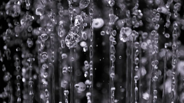 Air bubbles in the water isolated on black background — Stock Photo, Image