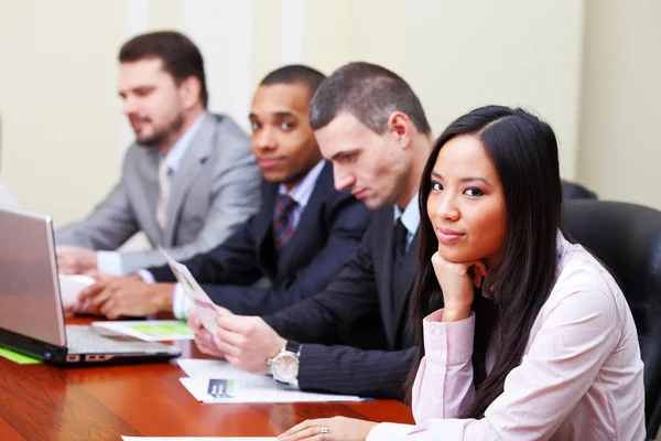 Multi ethnic business executives working with documents — Stock Photo, Image