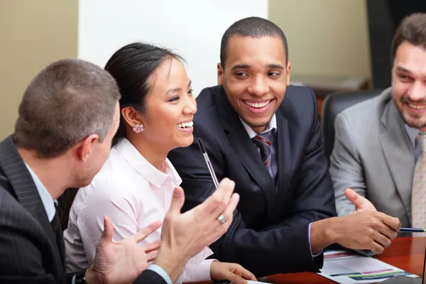 Diverse business group laughing at the meeting Royalty Free Stock Images
