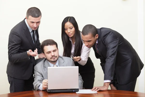 Diverse business group working with computer Stock Image