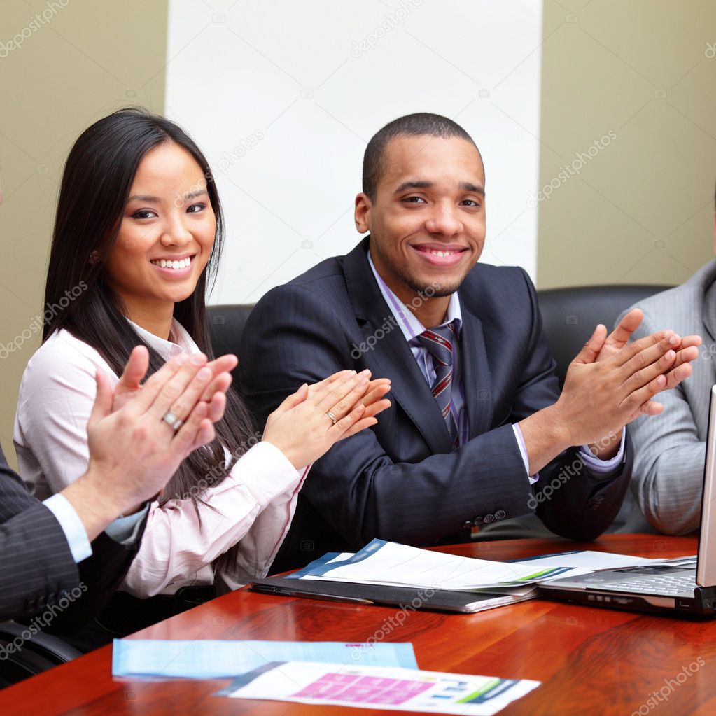 Multi ethnic business group greets you