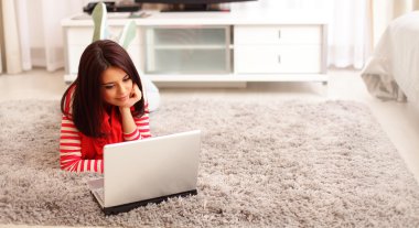 Young woman with laptop clipart