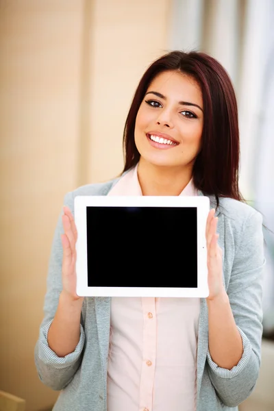 Beautiful woman holding a tablet — Stock Photo, Image