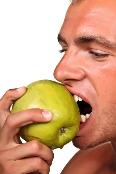 Jovem comendo maçã — Fotografia de Stock