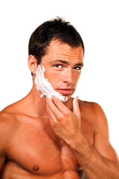 Genç yakışıklı adam tıraş oluyor. — Stok fotoğraf
