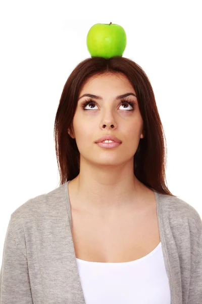 Woman with apple on her head — Stock Photo, Image