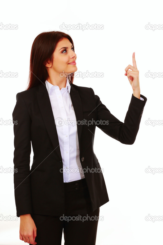 Businesswoman pointing up at copyspace