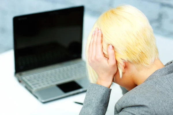 Businesswoman having a headache — Stock Photo, Image