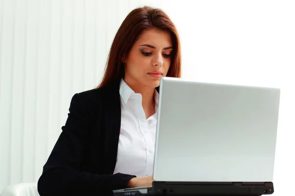 Businesswoman looking at display laptop Stock Image