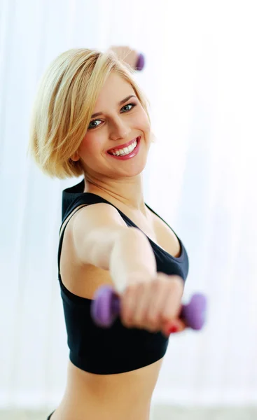 Fit woman with dumbbells — Stock Photo, Image