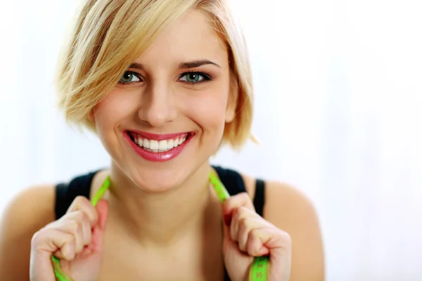 Fit woman with measure tape — Stock Photo, Image