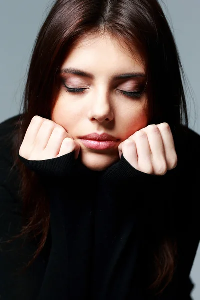 Pensive woman with closed eyes Stock Photo