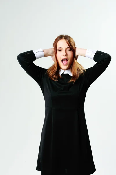 Woman closing her ears and screaming — Stock Photo, Image
