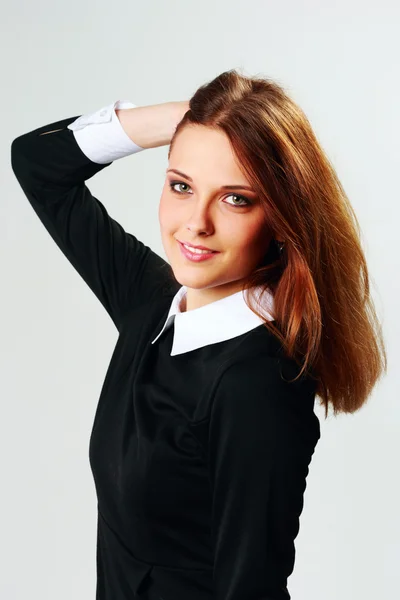 Young happy woman touching her head — Stock Photo, Image