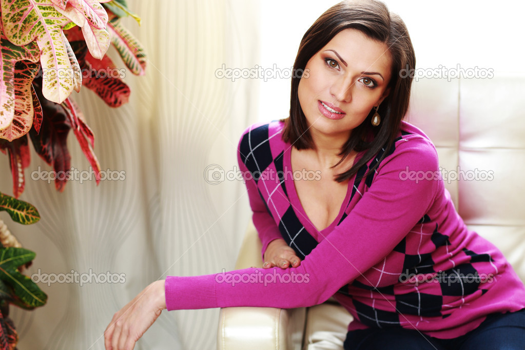 Woman sitting on the sofa at home