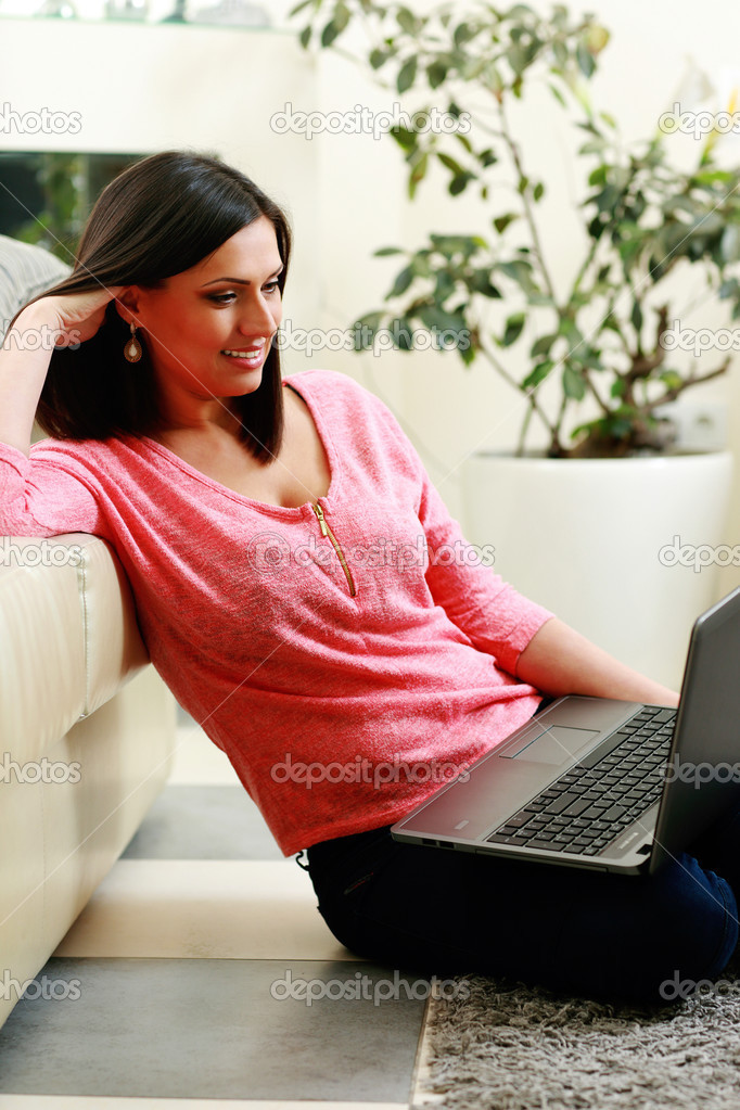 Woman sitting on the floor with laptop