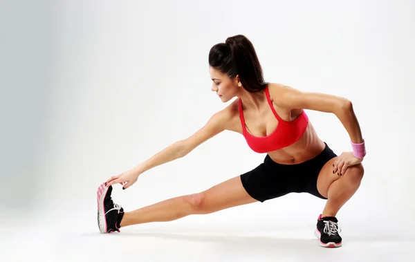 Woman stretching legs — Stock Photo, Image