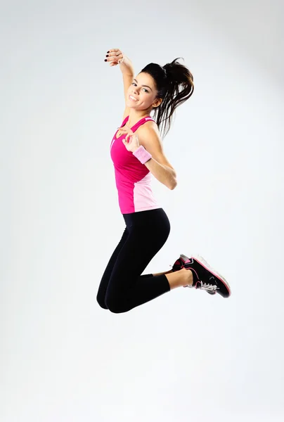 Mujer deportiva saltando — Foto de Stock