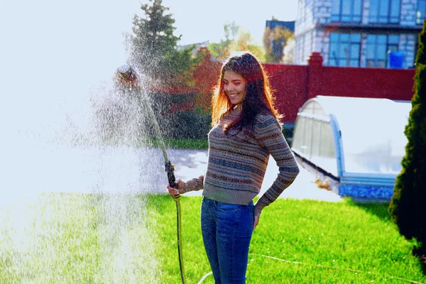 Beautiful woman in garden — Stock Photo, Image