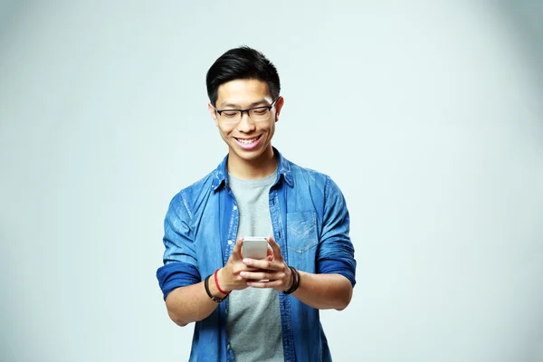 Young handsome asian man in glasses — Stock Photo, Image