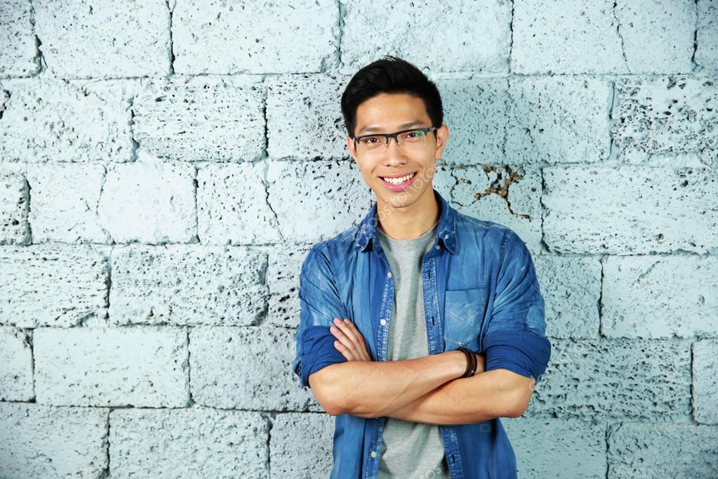 Young handsome asian man in glasses