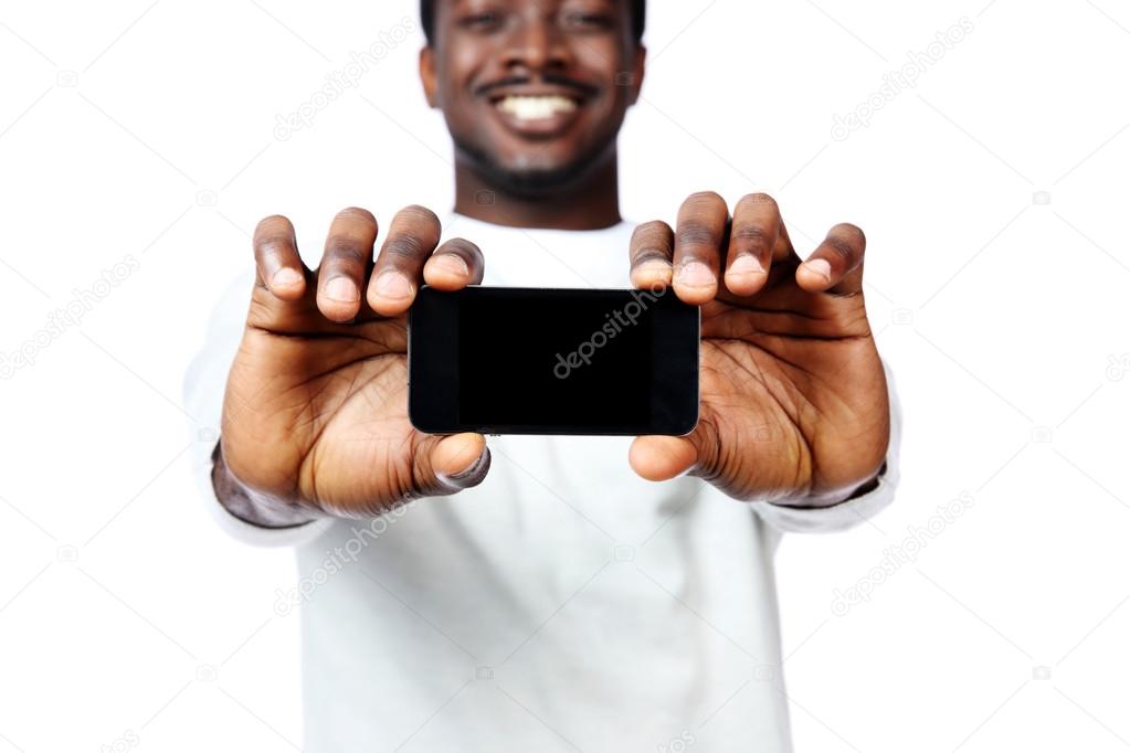 African man showing blank smartphone display