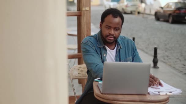 Confident African Man Working Paper Documents Cafe Outdoors — Stock Video