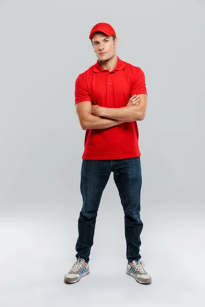 Young Delivery Man Wearing Uniform Posing Arms Crossed Isolated White — Stock Photo, Image