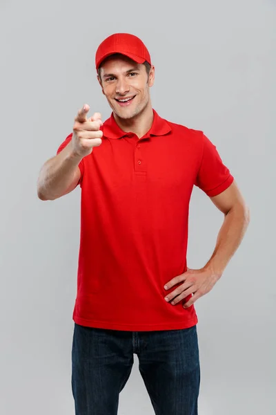 Young Delivery Man Wearing Uniform Smiling Pointing Finger Camera Isolated — Stock Photo, Image