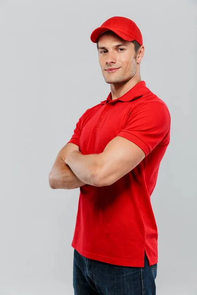 Young Delivery Man Wearing Uniform Smiling While Posing Arms Crossed — Stock Photo, Image