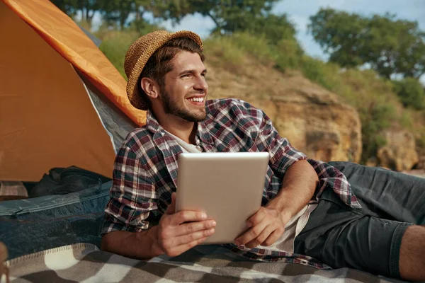 European Guy Resting Using Digital Tablet While Laying Blanket Tent — Stock Photo, Image