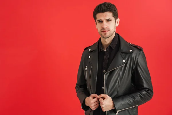 Young Unshaven Man Wearing Leather Jacket Looking Camera Isolated Red — Stock Photo, Image