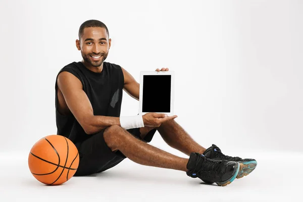 Happy African Young Basketball Player Sitting Showing Blank Screen Tablet — Stock Photo, Image