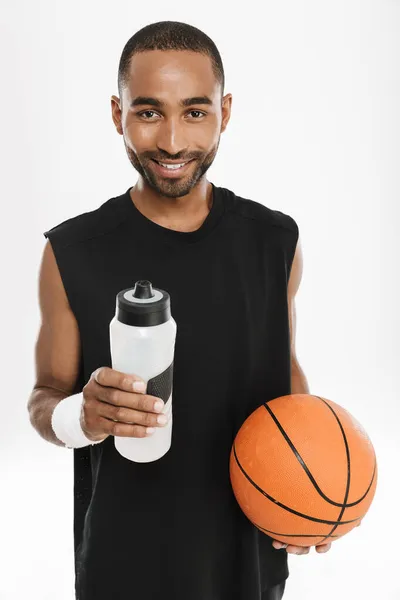 Young Black Sportsman Drinking Water While Posing Basketball Isolated White — Stock Photo, Image