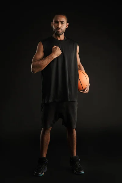 Young Sportsman Gesturing While Posing Basketball Isolated Black Background — Stock Photo, Image